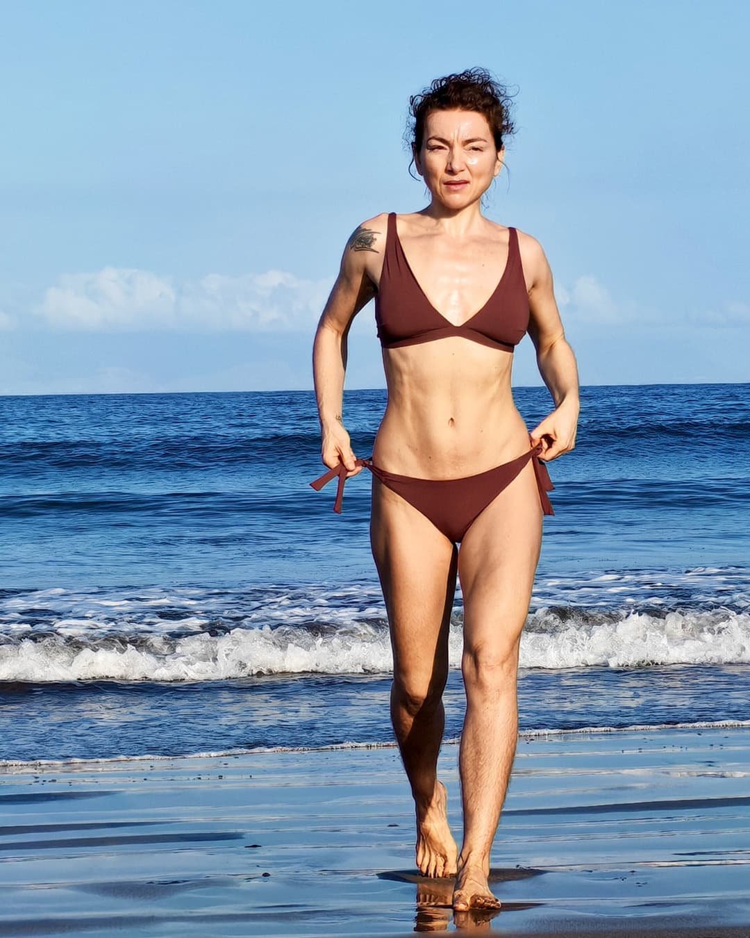 Jeanina on the same beach, before and after the Lean on Carbs lifestyle — Now